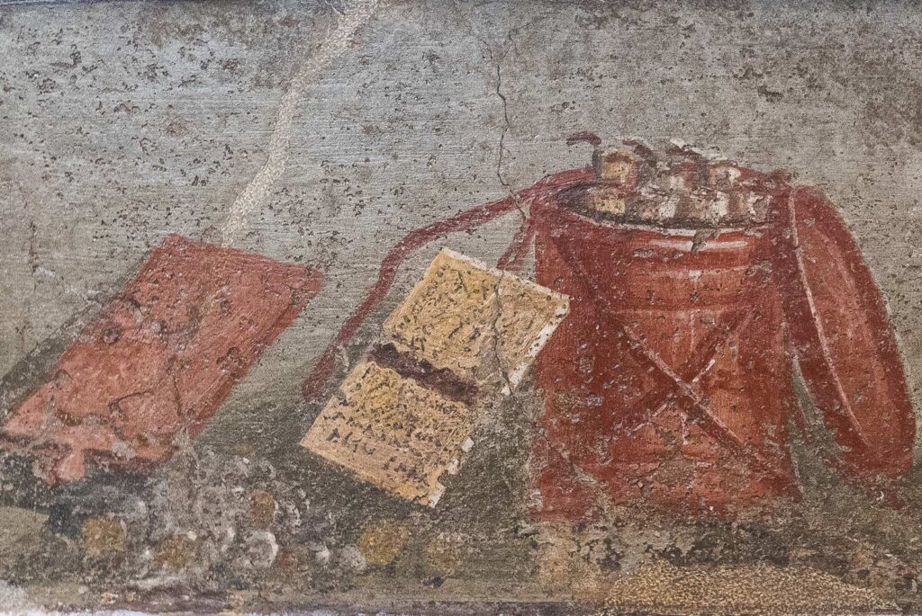 Roman fresco depicting everyday objects, including a scroll and a red bucket.
