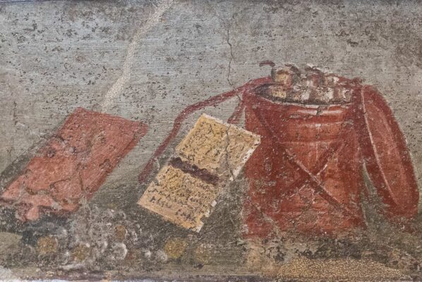 Roman fresco depicting everyday objects, including a scroll and a red bucket.