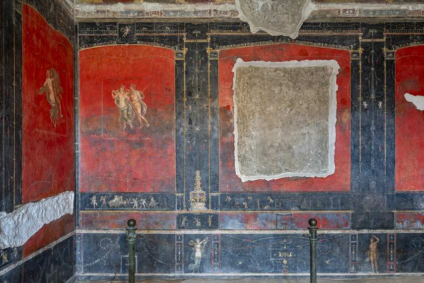 Pompeian red frescoes in the House of the Vettii in Pompeii