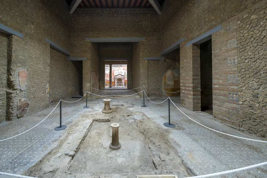 Interior of the House of the Small Fountain in Pompeii with central structure and columns