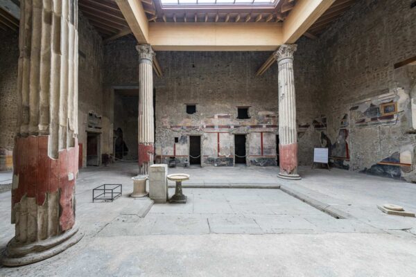 Atrium with columns and frescoes in the House of the Silver Wedding in Pompeii