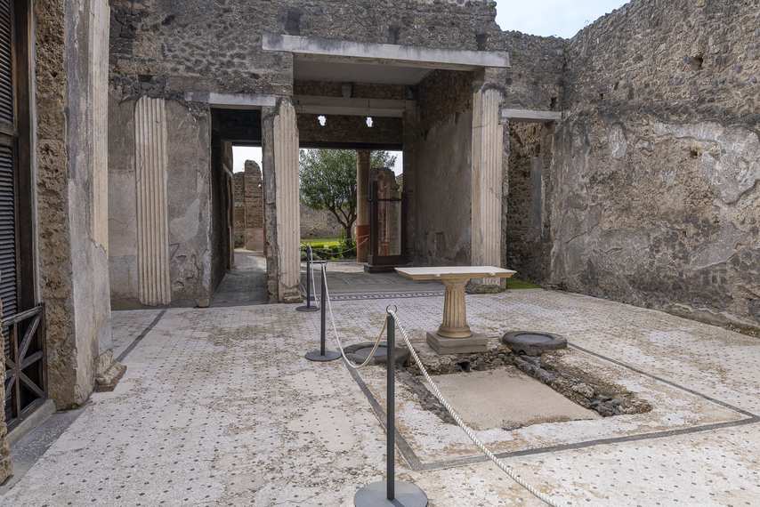 Atrium of theHouse of the Orchard in Pompeii with impluvium and stone columns