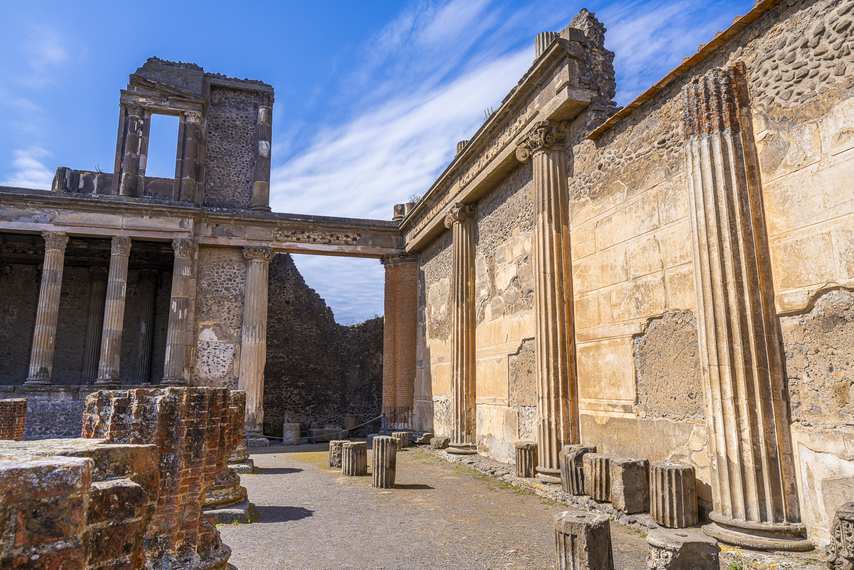 Ruins of the Basilica of Pompeii under an overcast sky
