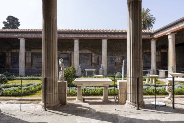 Indoor garden with statues and columns in the House of the Vettii in Pompeii