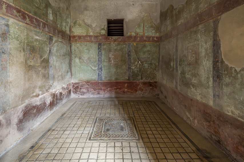 Mosaic and frescoes on a green background in the House of the Cryptoporticus in Pompeii