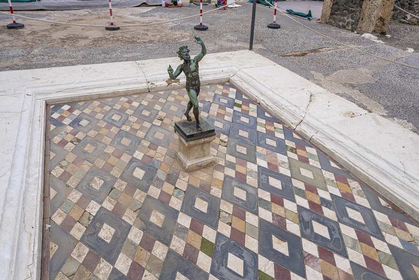 Statue of the dancing faun in the fountain of the House of the Faun