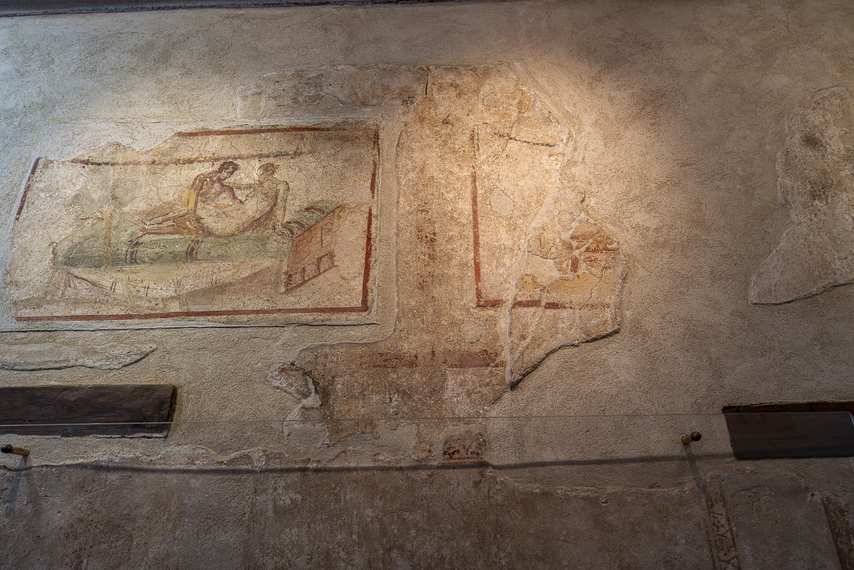 Erotic fresco on wall of the Lupanar of Pompeii