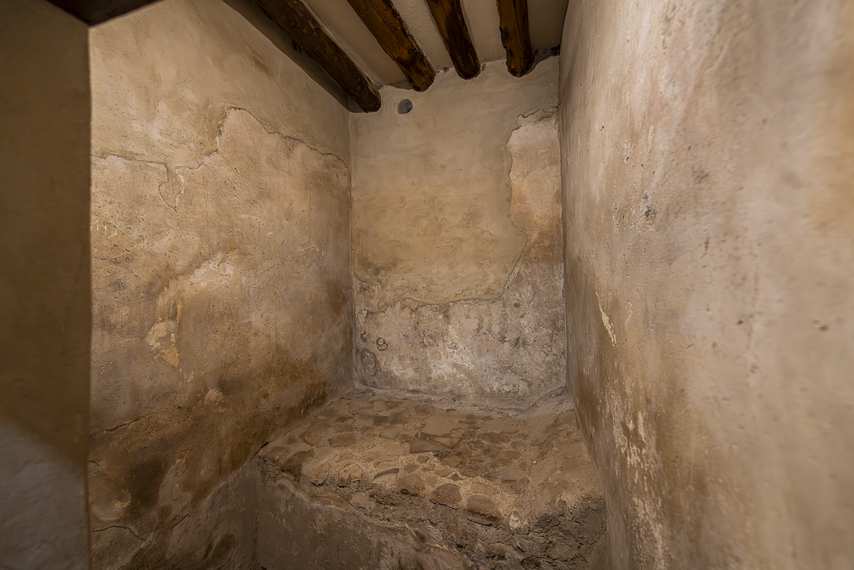 Room with stone bed at the Lupanar of Pompeii