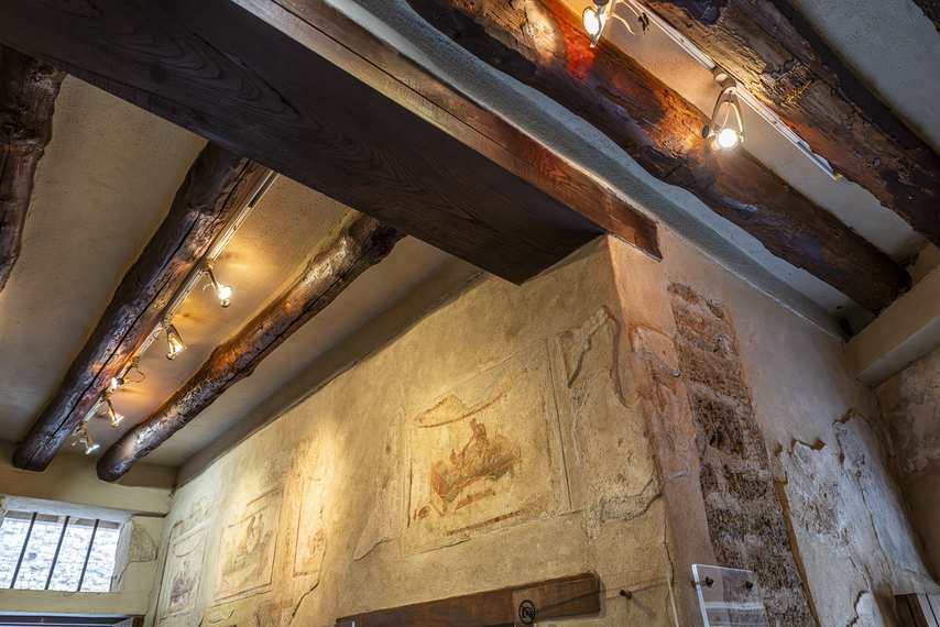 View of the ceiling with wooden beams and frescoes in the Lupanar of Pompeii