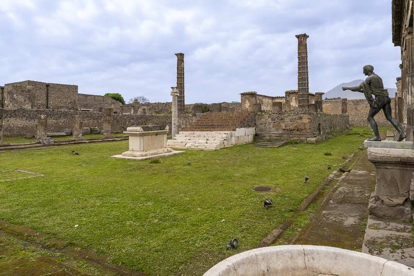 View of the Temple of Apollo in Pompeii with columns, altar and bronze statue