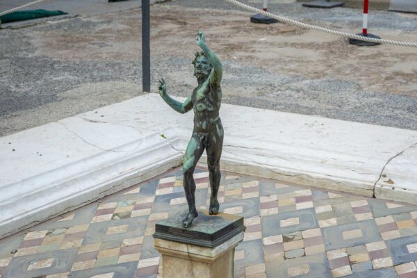 Close-up of the dancing faun statue in Pompeii