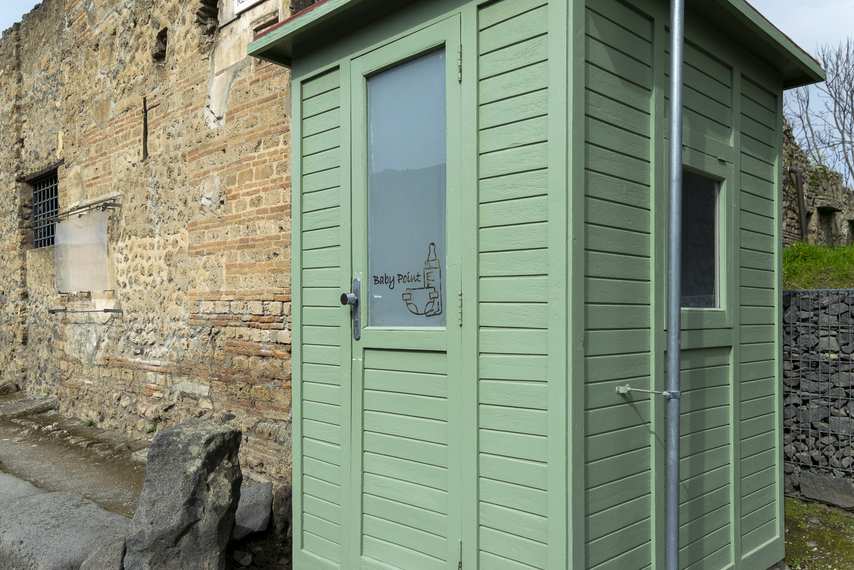 Green structure of Baby Point changing table in the Pompeii Archaeological Park