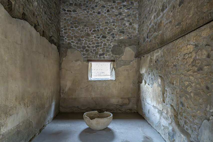 Stone basin inside a room in the House of Sirico in Pompeii